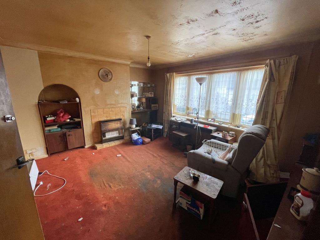 Lot: 6 - THREE-BEDROOM SEMI FOR REFURBISHMENT - Living room with window looking out to road